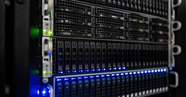 Close-up of high-density server racks with blue and green status lights in a modern data center