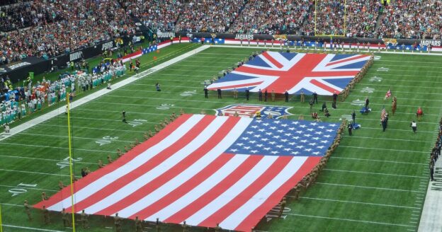 Union Jack and American flags on the field at Tottenham Hotspur Stadium, where Cam Little kicked the 57-yard game-winner