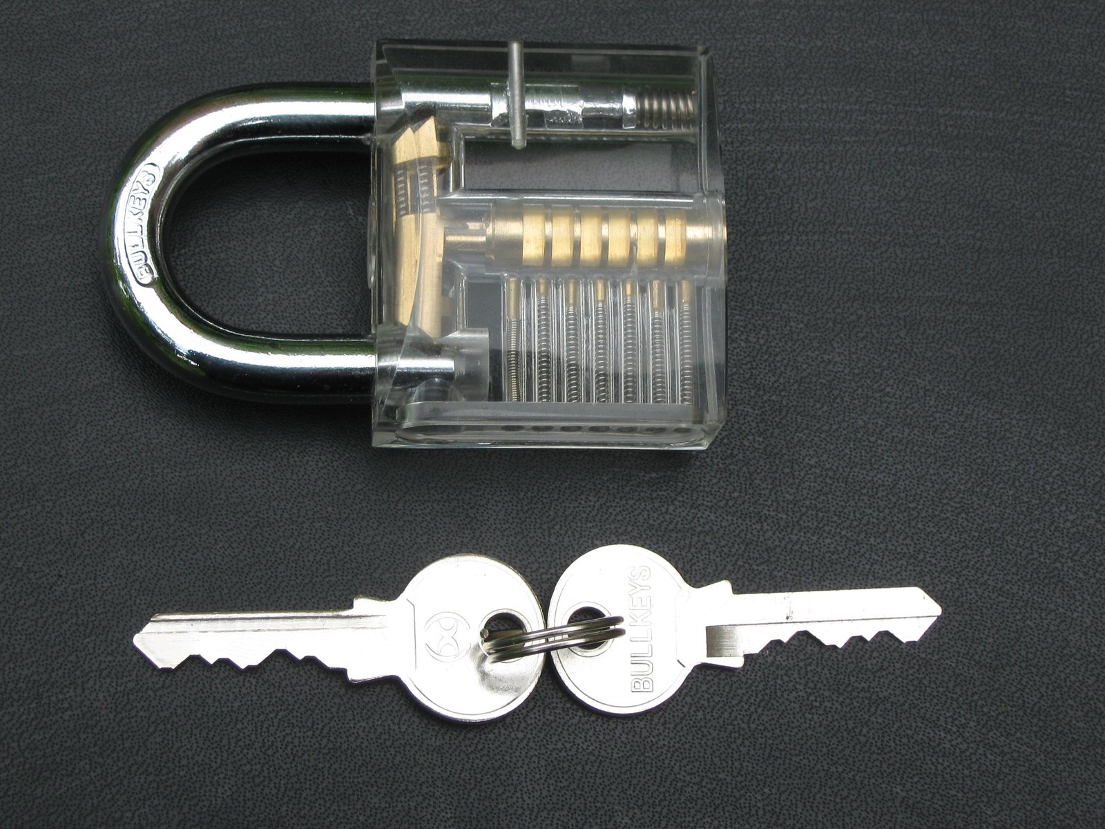 Clear padlock with a set of keys