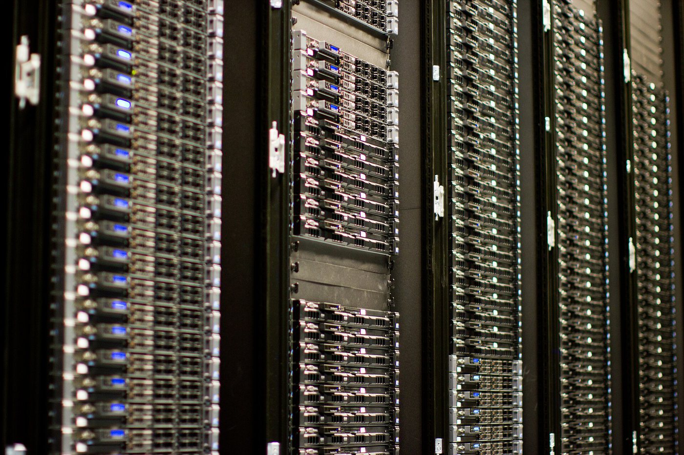 Rows of server racks with blinking lights in a data centre