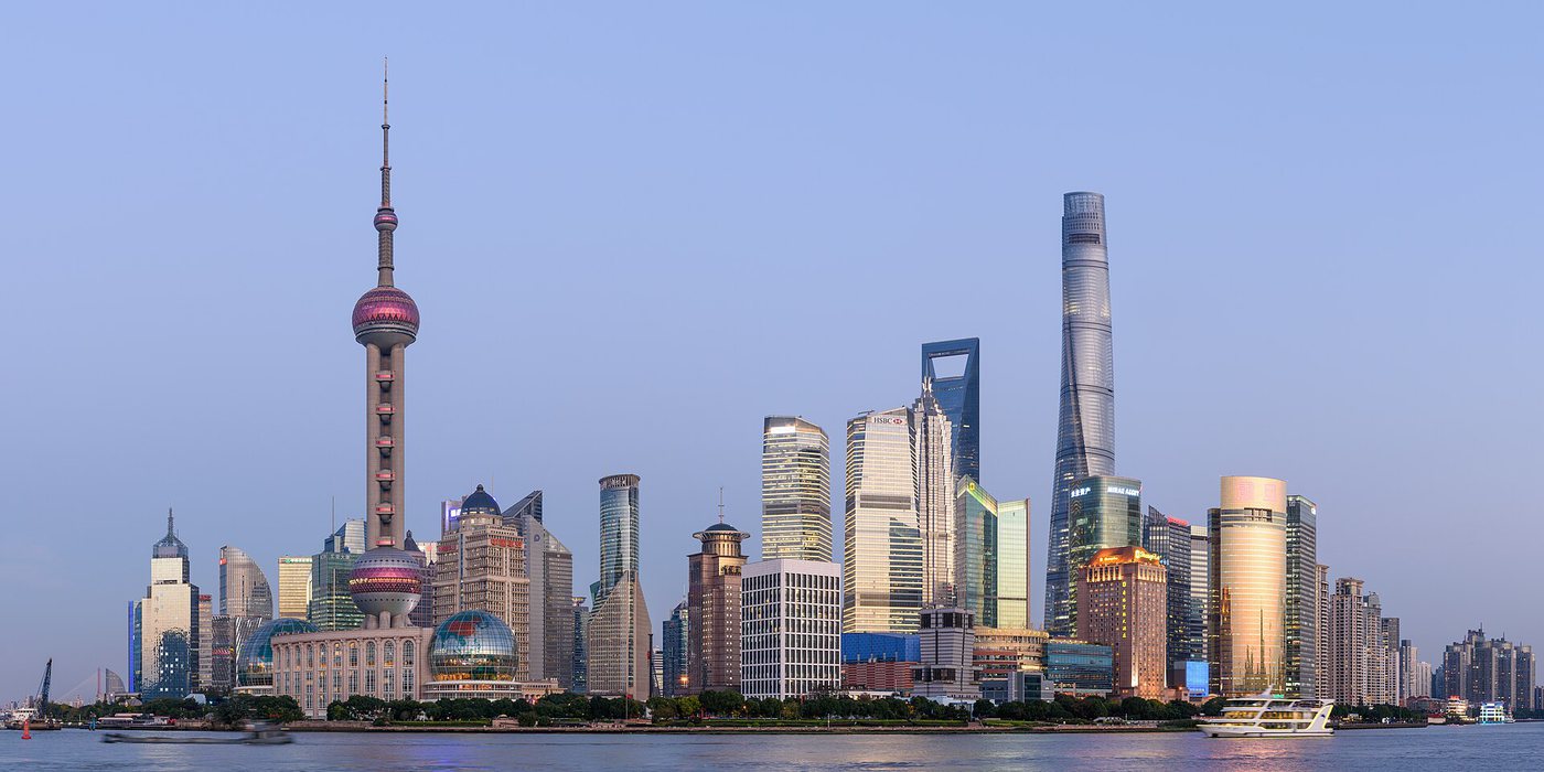 Panorama of the Shanghai Pudong skyline with the Oriental Pearl Tower and skyscrapers along the Huangpu River